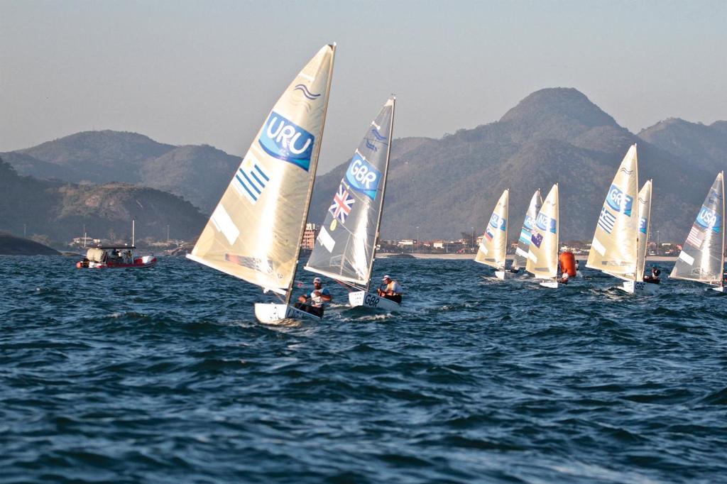 Day 7 - Finn August 14, 2016. Gilles Scott (GBR) finishes second ahead of the key rivals and with sufficient points to win the Gold medal © Richard Gladwell www.photosport.co.nz